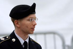 Army Pfc. Bradley Manning is escorted into a courthouse in Fort Meade, Maryland, Tuesday, May 21, 2013, before a pretrial military hearing. (AP Photo/Patrick Semansky)