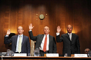 Tim Probert (right) of Halliburton is sworn in along with officials from BP and Transocean before May 11 Senate hearings on the Gulf oil spill. Photo credit: Tim Sloan/AFP/Newscom.