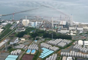 An aerial view shows the Fukushima Daiichi nuclear power plant and its storage tanks for contaminated water (bottom) August 20. Leakage from a temporary storage tank has raised new concerns about the ongoing problems at the plant. Photograph by Kyodo/Reuters. Published August 21, 2013