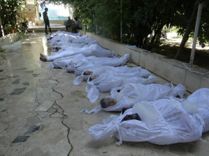 A handout image released by the Syrian opposition's Shaam News Network shows bodies of children wrapped in shrouds as Syrian rebels claim they were killed in a toxic gas attack by pro-government forces in eastern Ghouta, on the outskirts of Damascus on August 21, 2013. (AFP/Shaam News Network)