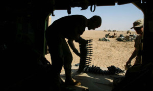Spc Travis Hunter loads armor-piercing depleted uranium-tipped 25mm shells during the second Iraq war Photograph: John Moore/AP