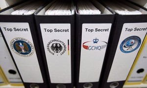 In this photo illustration, the logos of intelligence agencies the NSA, BND, GCHQ, DGSE are displayed on folders. Photograph: Ulrich Baumgarten via Getty Images
