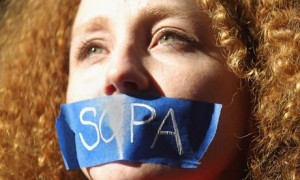 A protester demonstrates against the proposed Stop Online Piracy Act (Sopa) in New York. It might be time to do the same against the Trans-Pacific Partnership. Photograph: Mario Tama/Getty Images