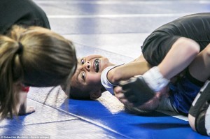 Effort: Kristofer "The Arm Collector" Arrey, 7, chokes Mason Bramlette, 7, during 2013 California State Pankration Championships Youth Division. Pankration is a version of the popular Mixed Martial Arts (MMA)-style fighting that is adapted for children