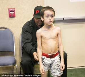 Parker, Arizona, United States: Cross Betzhold, 6, is inspected before his fight in a USFL