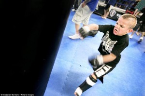 Sacramento, California, United States: Mason "The Beast" Bramlette, 7, trains at the Ultimate Fitness Gym before the 2013 California State Pankration Championships Youth Division