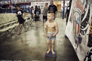 San Bernardino, California, United States: Mason "The Beast" Bramlette, 7, is weighed in before a tournament at Adrenaline Combat Sports and Fitness in San Bernardino