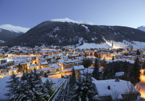 Bloomberg Enlarge Image Snow covered buildings are seen at dusk from the Schatzalp area above the town of Davos, Switzerland.