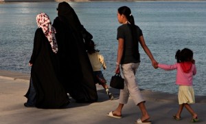 Qatari women with their children and housemaid strolling in Doha. Photograph: Stock Connection/REX