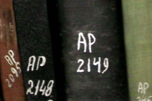 “Palestinian-owned books at Israel’s National Library, marked ‘AP’ for ‘abandoned property. (Screenshot from ‘The Great Book Robbery’)