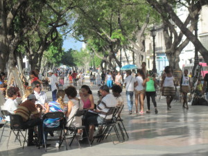 People in a circle on Paseo de Marti in Havana