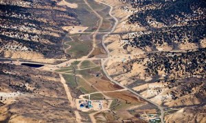 A large field of fracking sites in a Colorado valley. 'The industry’s singular solution to the climate crisis is to dramatically expand an extraction process that releases massive amounts of climate-destabilising methane.' Photograph: Ted Wood/Aurora Photos/Corbis