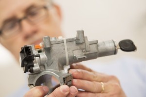 Michael Spooneybarger/Reuters - Consulting materials engineer Mark Hood shows the ignition assembly which has a faulty 2005 ignition switch (black piece at left), in the mechanical testing laboratory at McSwain Engineering, Inc. in Pensacola, Florida, March 28, 2014.