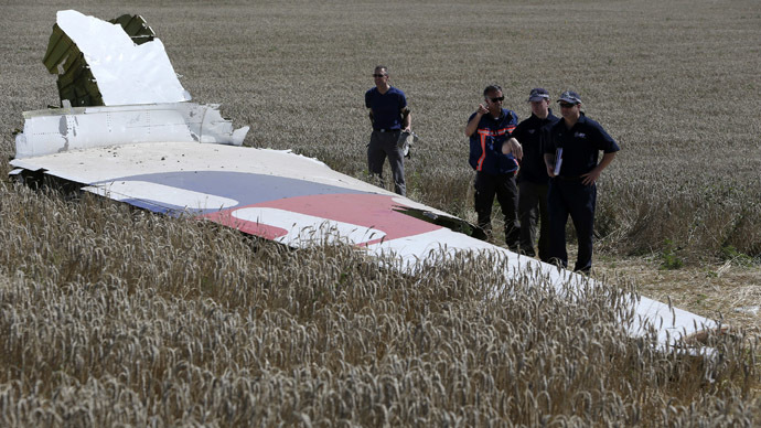 Members of a group of international experts inspect wreckage at the site where the downed Malaysia Airlines flight MH17 crashed, near the village of Hrabove (Grabovo) in Donetsk region, eastern Ukraine August 1, 2014. (Reuters)