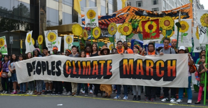 Photo: Demonstrators participating in the People's Climate March 21 September 2014. South Bend Voice via Wikimedia Commons.