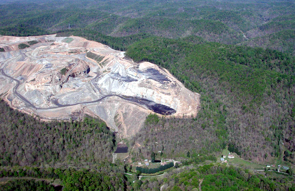Mountaintop removal coal mine in southern West Virginia encroaching on a small community. Photo credit: Vivian Stockman