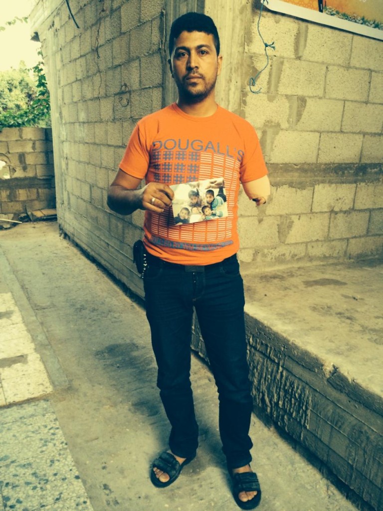Broken Families: Nabil Siyam holds a photo of his five children, four of whom died in bombings Sarah Helm