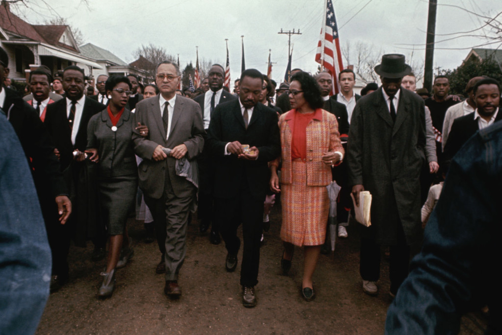 10 of 21Martin Luther King Jr. Photo Gallery: King and his wife, Coretta, march with other civil rights activists through a neighborhood in Selma in 1965. (Photo: Flip Schulke/CORBIS)