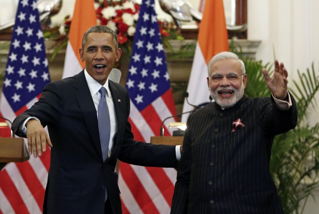  President Obama and Indian Prime Minister Narendra Modi wave after issuing a statement in New Delhi on Jan. 25. (Adnan Abidi/Reuters)