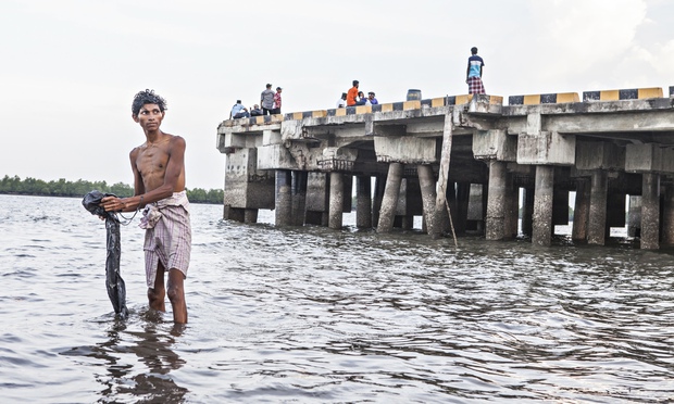 Migrants from Burma and Bangladesh are fleeing persecution and poverty. Photograph: Antonio Zambardino/Guardian
