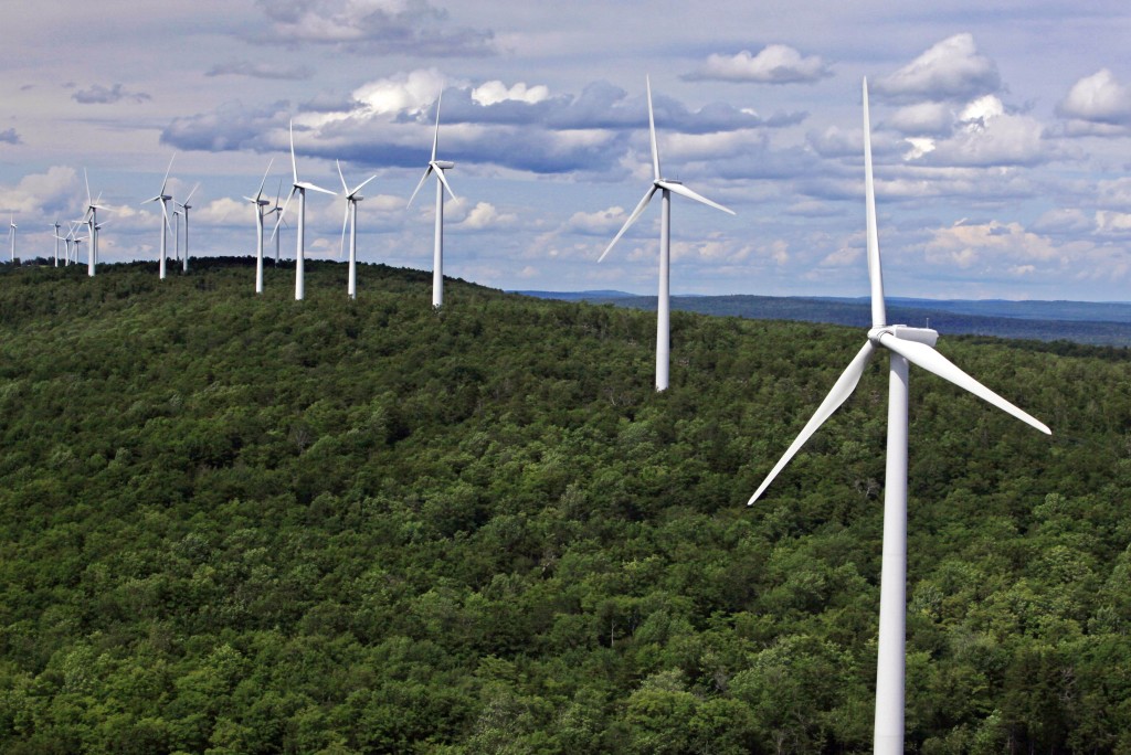 FILE- In this file photo made July 14, 2009, wind turbines line a ridge on Stetson Mountain in Stetson, Maine. The state became the regional wind power leader under Democratic Gov. John Baldacci, but change is in the air as Gov. Paul LePage makes an aggressive push away from his predecessors renewable energy policies. The outspoken Republican, who says wind power is too expensive, is looking to hydropower from Canada and natural gas to bring down electricity prices that are among the highest in the country. (AP Photo/Robert F. Bukaty, File)