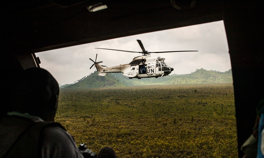A United Nations helicopter carrying a high-level delegation travels to the town of Kiwanja in Congo. Photograph: Pete Muller/New York Times/Redux/eyevine