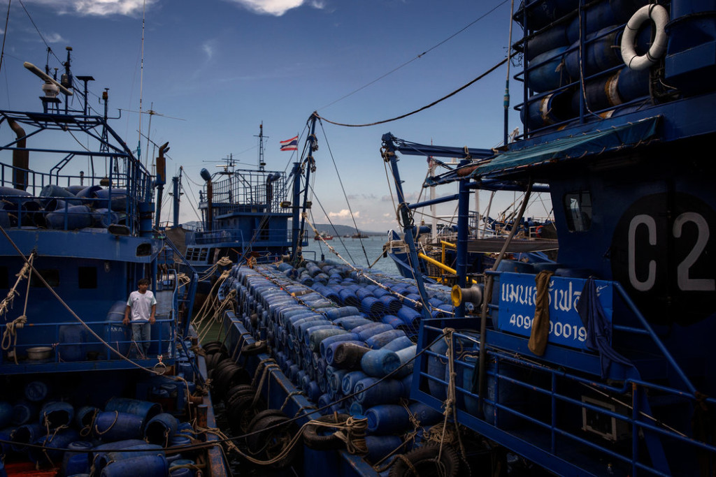 A mothership in Songkhla. These large vessels carry barrels of ice and other supplies to fishing boats in international waters. Credit Adam Dean for The New York Times