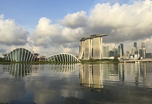 A reflection of the Singapore financial district is cast on the waters of a reservoir. Singapore celebrates its 50th anniversary of independence Aug. 9. (AP Photo)
