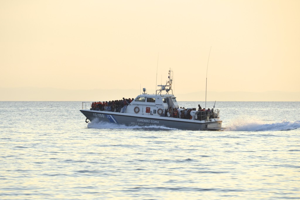 A Greek Coastguard ship rescues refugees crossing from Turkey into Europe.