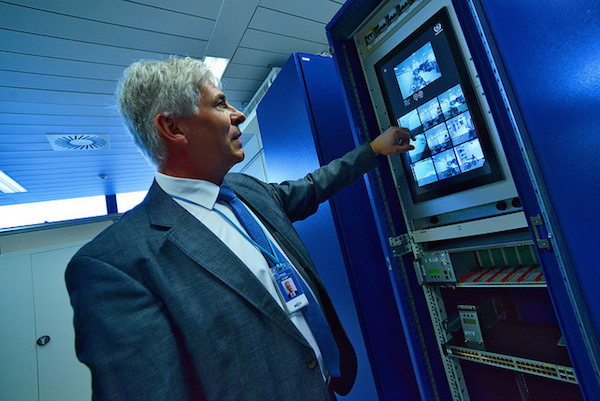 An IAEA expert demonstrating how the safeguards Next Generation Surveillance System (NGSS) works, March 20, 2015. A large part of the the IAEA’s inspection regime utilizes remote surveillance and detection equipment. (Photo: Dean Calma / IAEA)