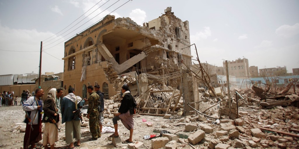 Photo: Shiite rebels known as Houthis, gather at houses destroyed by a Saudi-led airstrike in Sanaa, Yemen, July 3, 2015 