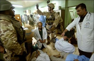 Doctors at Falluja General Hospital handcuffed and pushed to the floor when U.S. troops seize the facility, November 8. (Photo: New York Times)