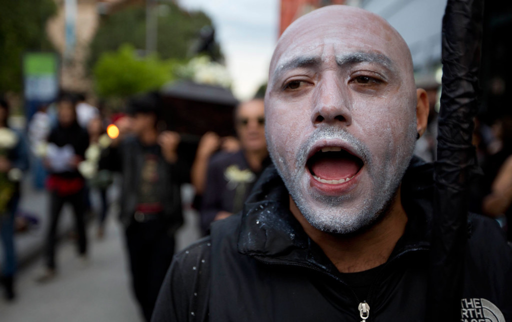  A demonstrator shouts during protests around general elections in Guatemala City. (AP Photo / Moises Castillo)