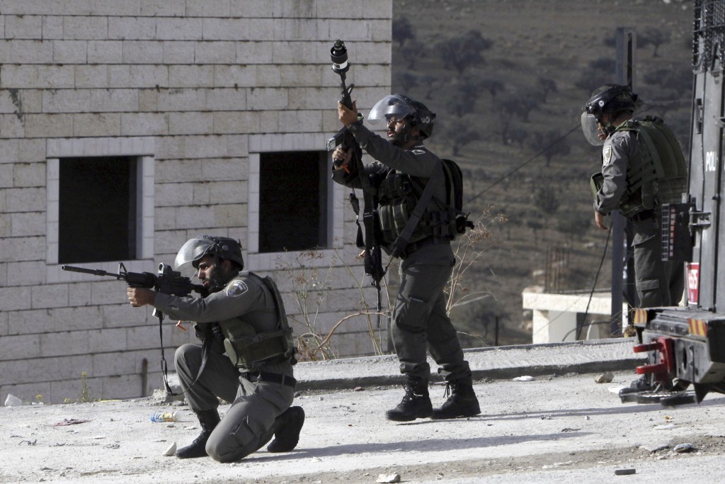 Israeli border police deploy during clashes with Palestinian students in Abu Dis,West Bank, Monday, Nov. 2, 2015. CREDIT: AP Photo/Mahmoud Illean