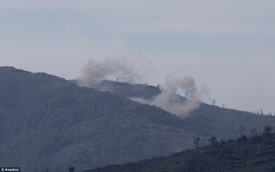 2ECCAF6900000578-3333117-Retaliation_A_view_from_Hatay_in_Turkey_shows_smoke_rising_from_-a-62_1448454940316