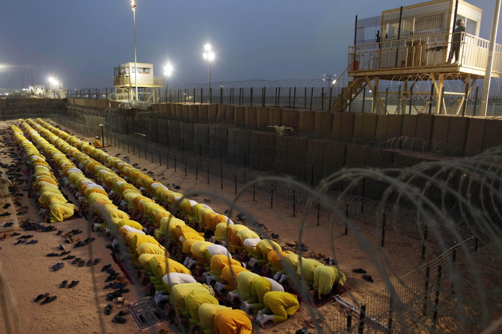 Detainees pray at Camp Bucca, a U.S.-run facility that closed in 2009. AP