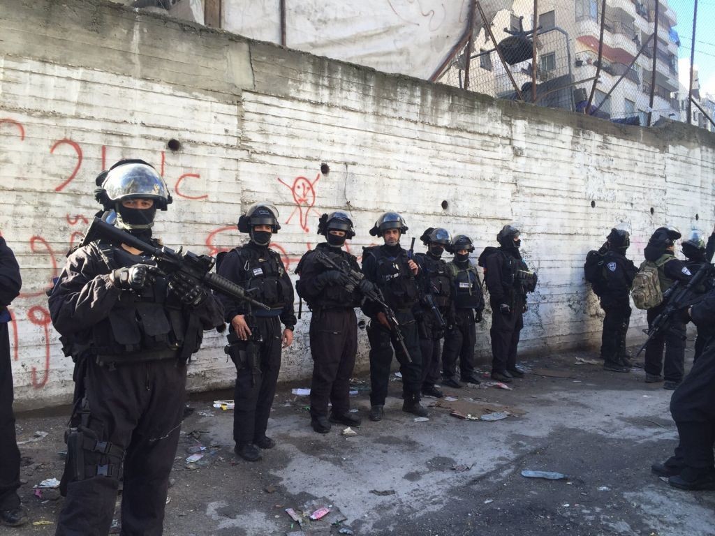 Increasingly frequent home demolitions prompt increasingly angry protest points out John Kerry. This large police guard is needed for a home demolition in Shoafat refugee camp, December 2nd, 2015. Photo from Israel police.