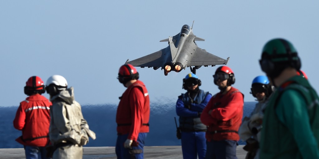 A French Rafale fighter aircraft takes off with bombs from the French aircraft carrier Charles-de-Gaulle on Nov. 23, 2015, in the eastern Mediterranean Sea, as part of Operation Chammal in Syria and Iraq against the Islamic State. Photo: Anne-Christine Poujoulat/AFP/Getty Images