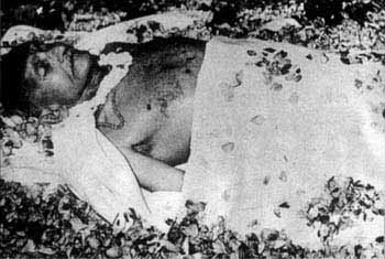 Mahatma Gandhi with flowers, dead.
