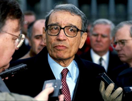 U.N. Secretary-General Boutros Boutros-Ghali is surrounded by members of the media as he leaves the White House after meeting U.S. President Bill Clinton, in this February 23, 1993 file picture. Reuters/Stringer/Files