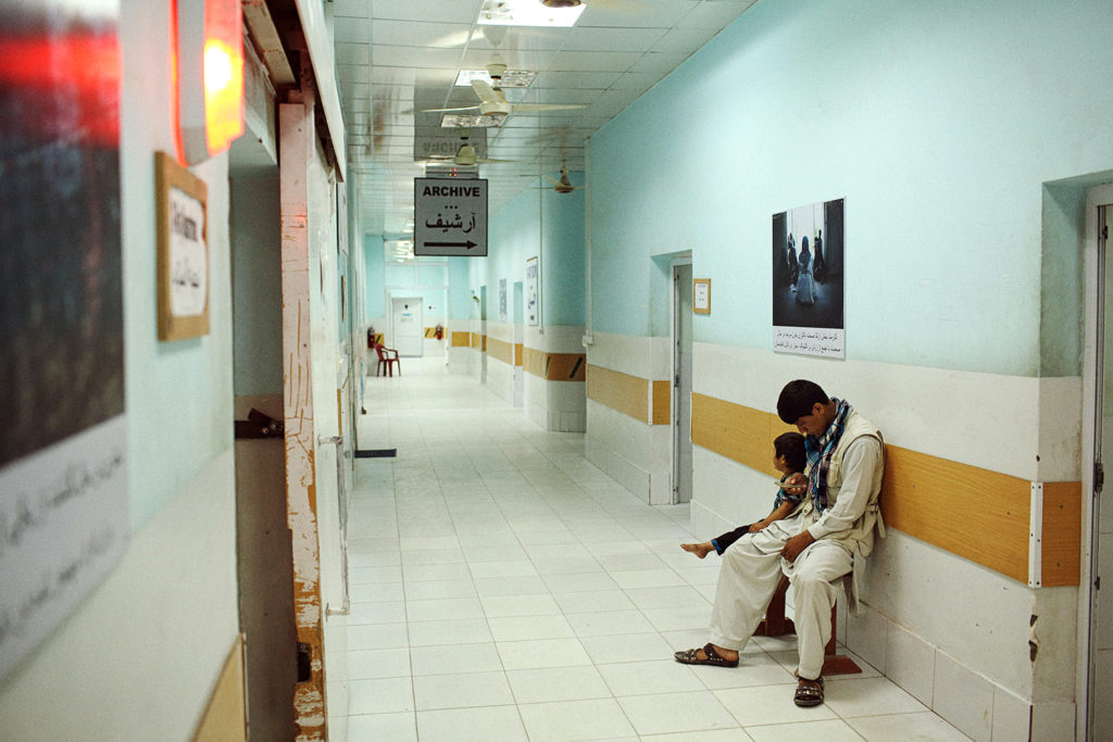 A young patient waits to be X-rayed with her father at the Kunduz Trauma Center run by Médecins Sans Frontières, May 20, 2015. Photo: Andrew Quilty/Oculi