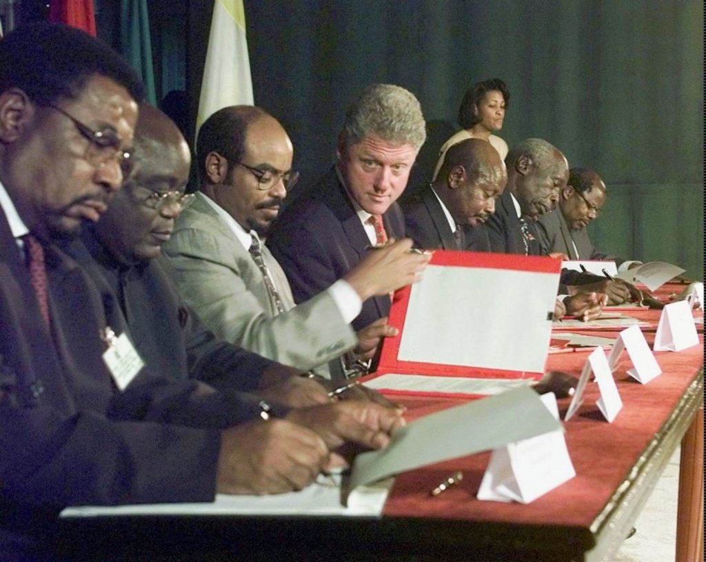  President Bill Clinton watches African leaders sign an agreement on the prevention of genocide, at the Entebbe Summit for Peace and Prosperity held in Entebbe, Uganda Wednesday, March 25, 1998. (AP Photo/Greg Gibson)