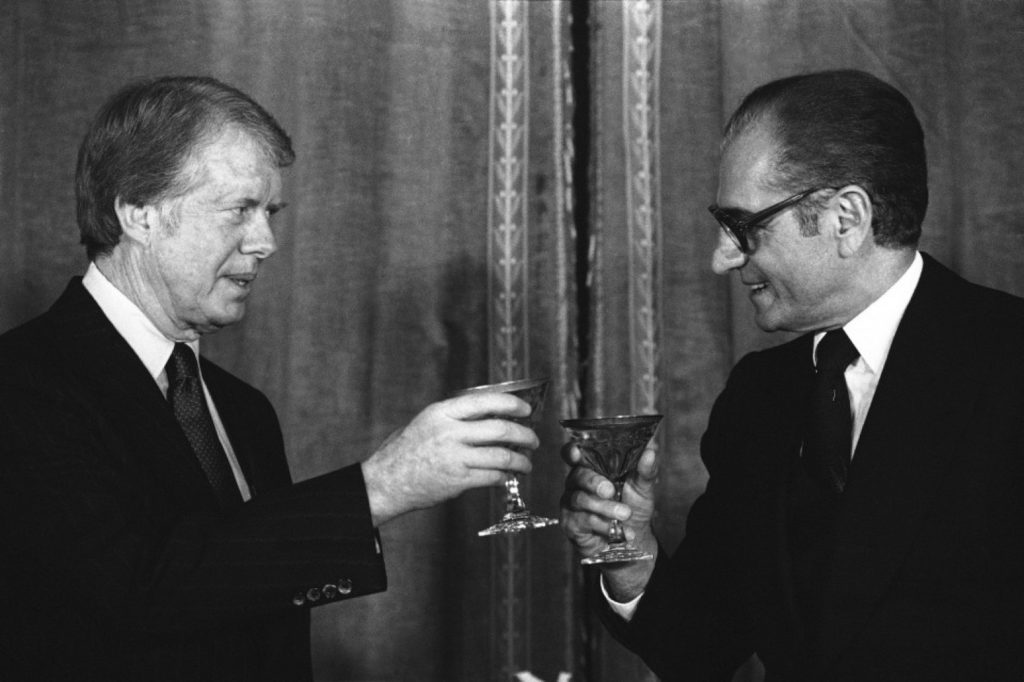  President Jimmy Carter toasts the Shah Mohammad Reza Pahlavi of Iran during New Year’s Eve dinner at Niavaran Palace in Tehran on Saturday, Dec. 31, 1977. (AP Photo)