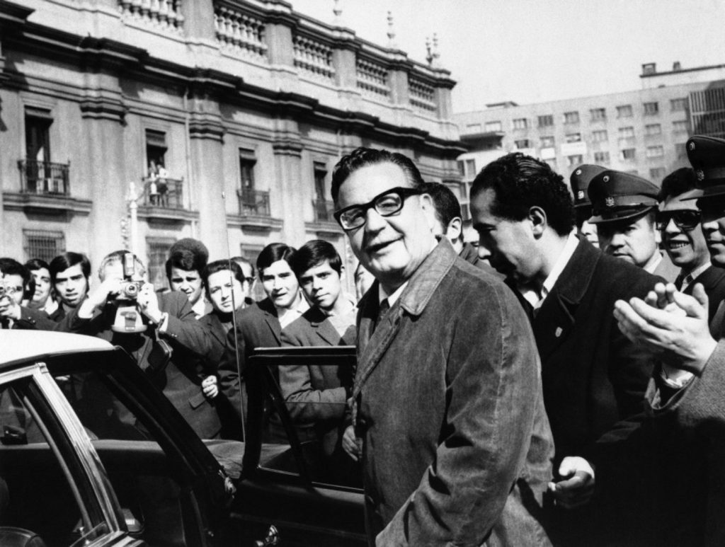  Socialist Senator Salvador Allende, (eyeglasses), one of three presidential candidates, leaves Government House on Aug. 27, 1970 in Santiago, Chile. (AP Photo)