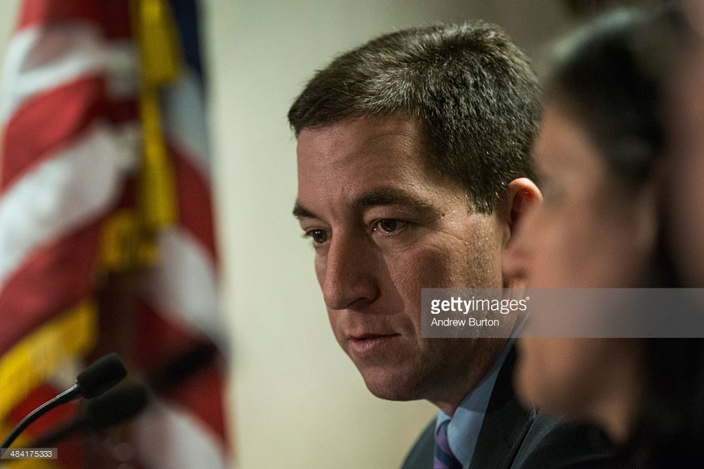 NEW YORK, NY - APRIL 11: Investigative reporter Glenn Greenwald, who worked with National Security Agency leaker Edward Snowden, speaks at a press conference after accepting the George Polk Award along side Laura Poitras, Ewan MacAskill and Barton Gellman, for National Security Reporting on April 11, 2014 in New York City. Greenwald, Poitras and MacAskill reported on the story for The Guardian; Gellman wrote for The Washington Post. This is the first time Greenwald and Poitras have returned to the United States since the story broke. (Photo by Andrew Burton/Getty Images)