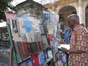 Professor and Afro-Latino scholar and activist Willie Thompson stops at a bookstand in Plaza de Armas, Habana. – Photo courtesy of Tarnel Abbott