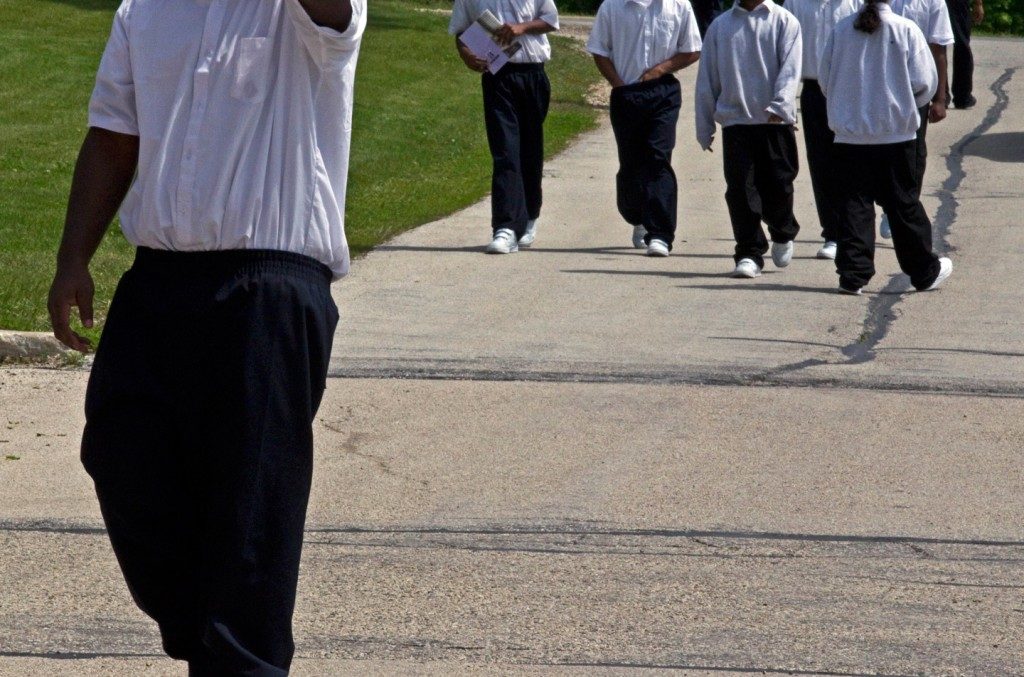 Youths make their way to class at the Wisconsin Department of Corrections Ethan Allen School in Wales, Wis., May 20, 2010. Photo: Morry Gash/AP