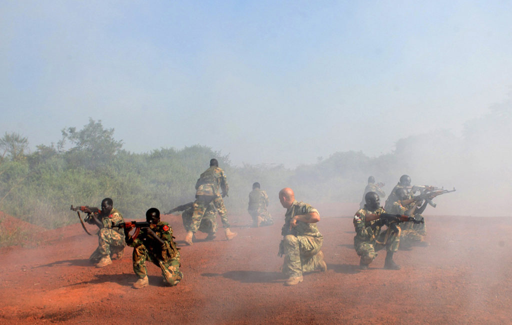 A U.S. Special Forces trainer supervises a military assault drill for a unit of the Sudan People’s Liberation Army, conducted in Nzara, South Sudan, on Nov. 29, 2013. Photo: Andreea Campeanu/Reuters/Newscom