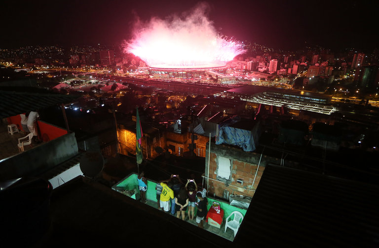 Residents of Mangueira, a favela in Rio de Janeiro, watched the opening ceremony of the Olympic Games on Aug. 5. Credit Mario Tama/Getty Images
