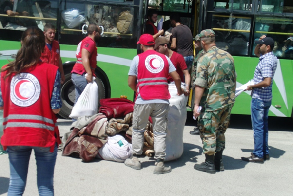 Thirty-five Syrian Arab Red Crescent Society (SARCS) volunteers were of critical help to many of the emaciated  countrymen boarding SARCS  busses with their life possessions moving to the south Damascus resettlement area. Photo:  Franklin Lamb (9/8/2016)